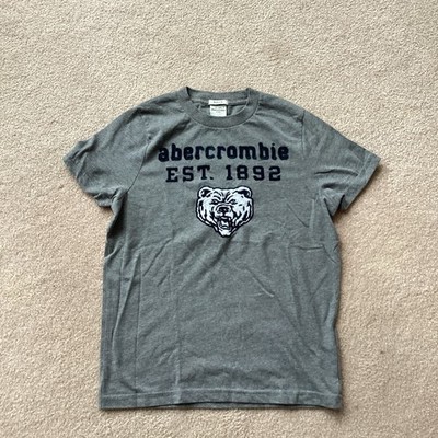 ABERCROMBIE KIDS SHORT SLEEVED MUSCLE T SHIRT, DESIGN ON FRONT, XL MEASURES10-12
