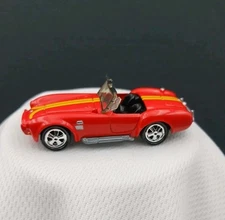 Johnny Lightning Red Shelby Cobra 427 Yellow Stripes