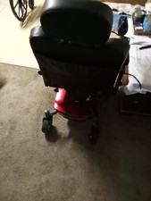 power wheelchair, red and black. Rechargeable and has charger. Very fast/quick