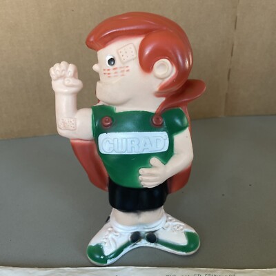 Vintage 1975 CURAD TAPED CRUSADER Coin Bank Werbung mit Tasche