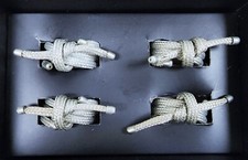 NEW SET OF 4 SILVER TONE KNOTTED ROPE / STRING SHAPE NAPKIN RINGS IN BOX