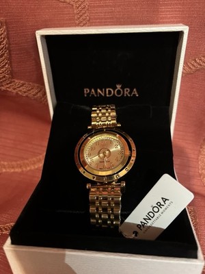 Pandora gold-tone watch in excellent condition. Includes original 