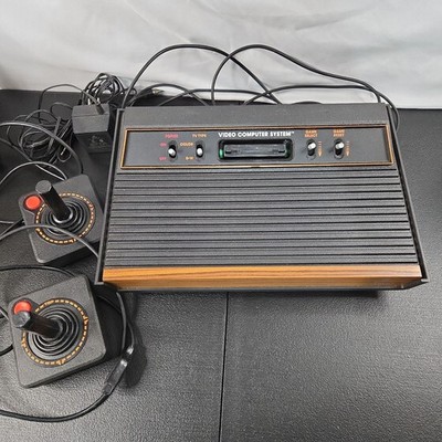 Atari 2600 Video Game Console with Power Adaptor and 2 OEM Controllers Untested