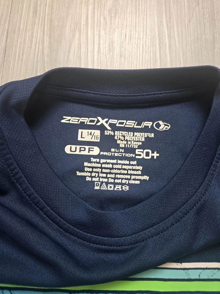 Camisa de sol ZEROXPOSUR azul manga corta para niño L 14/16 UPF 50+ Foto 2 de 4