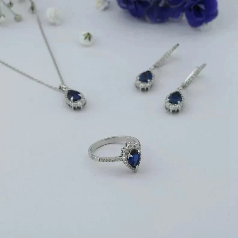 Juego de joyas para mujer enchapado en oro blanco de 14 quilates creado en laboratorio zafiro azul corte pera de 4 quilates Foto 2 de 4