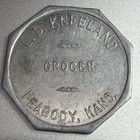 Kansas, Peabody L. D. Kneeland Grocer Aluminum Token 50¢ Merchandise 254647 — photo 1