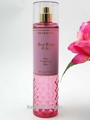 A fresh-cut bouquet of soft rose petals, rain-kissed ivy & creamy s...