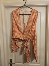 Ladies orange houndstooth wrap top by Kooiook, size L