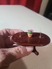 Miniature Dollhouse Table With Decor Attached And Unfinished Wood Sofa — photo 8