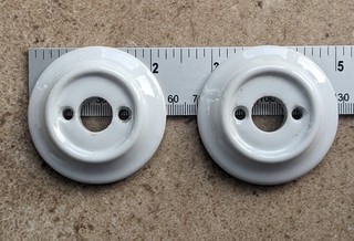 White ceramic doorknob roses with countersunk screw holes
