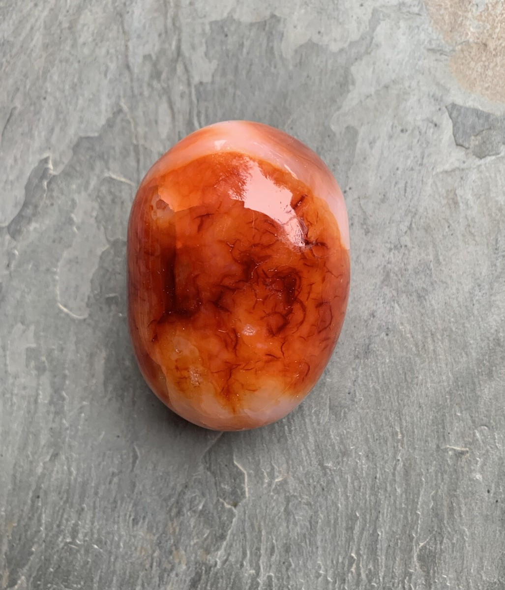 A Natural Carnelian Crystal Polished Palm Stone Massage Therapy