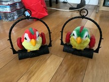 2 Used Battery-operated Repeating Parrots, Small, Red  Green, Perches Included