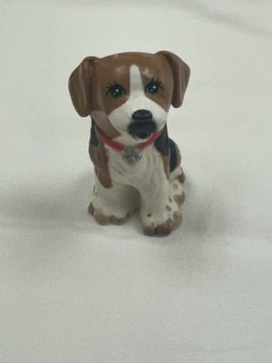 This is a ceramic beagle puppy figurine.
