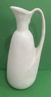 Signed Van Briggle Pottery Pitcher, appt 9” T x 3 1/2” W minor glaze discolor.