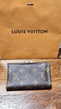 Vintage Louis Vuitton kiss lock coin wallet for Saks 5th Avenue