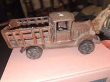 vintage cast-iron toy stake truck, closely resembling the 1920s 1930s C-cab Mack