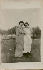 Two Smiling Girls Outside Friends 1910s RPPC Windy Landscape