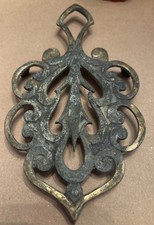 Vintage Patina Brass Tri-Footed Trivet With Intricate Scrollwork Design
