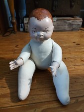 Ceramic head soft body doll.