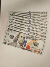 " PROP " money. Ten REPLICA 100 bills