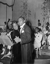 Jesse Owens whose flying feet are more at home at a cinder track g- Old Photo