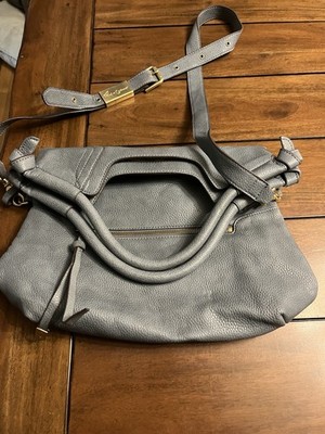 This is a Foley + Corinna Mid City Tote bag in a dusty blue-gray pebbled leather