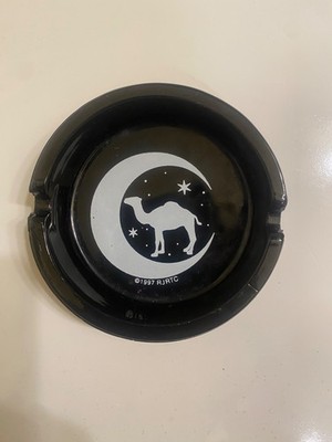 Black camel ashtrays 2 different styles both about 4 inches round