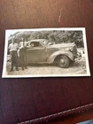 Photograph Two Men Standing Beside Old Car On the Side of the Road