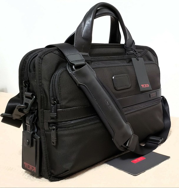 tumi triple compartment brief