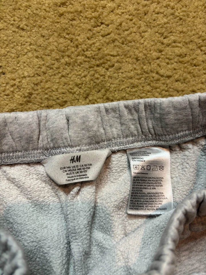 Pantalones deportivos H&M cintura elástica puño relajado polar gris niñas 12 Foto 3 de 4