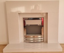 Image of fireplace surround with electric fire
