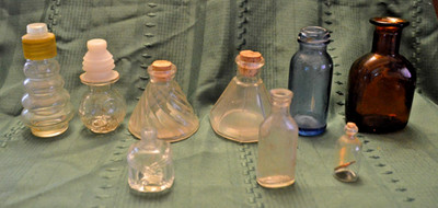 Glass Bottles Lot of 9 Some w/Lids, Some Without, 7 Clear, 1 Blue. 1 Amber Brown
