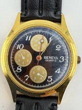 GENEVA QUARTZ WATCH MENS GOLD TONE BLACK DIAL BLACK STRAP JAPAN MOVT ANALOG
