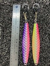 Dimple surface 12oz Diamond jig. Glow finish. Rigged w/400lb aramid assist hooks