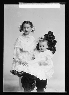 Photo:Burnadette Hacker Portrait Two Children in White Dresses
