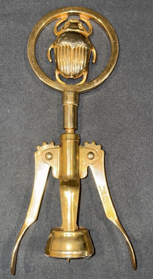 A gold-plated scarab beetle corkscrew from Italy — equal parts functional barware and wearable-quality art object.