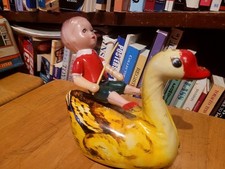 NICE VINTAGE  WIND UP CELLULOID & TIN BOY RIDING A SWAN
