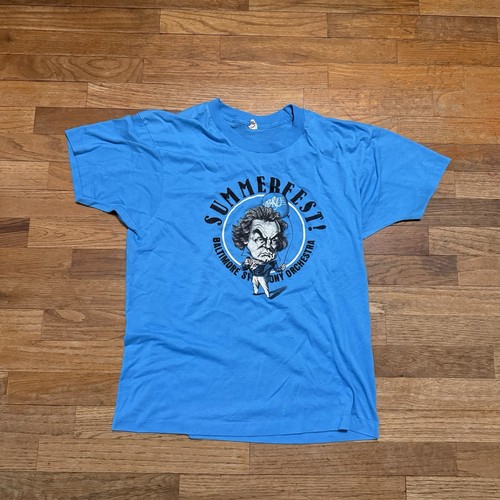 Blue vintage Baltimore Orchestra USA-made men’s T-shirt with cartoon figure and bold “Summerfest!” text, size L.
