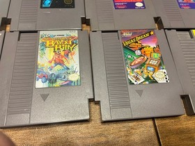 Lot of 8 Nintendo NES games including Mega Man 2 And 3 Mario 2 And 3 WWF Etc