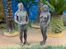 Lot of two (2) prehistoric man and woman figu...