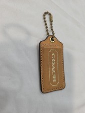 Coach Light Tan Glovetanned Leather Gold Tone Large Fob 3in Hang tag Brass Chain