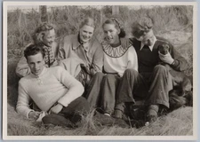 Smiling Group of Friends Relaxing with Dog on Sand Dunes, Germany 1955 BW Photo