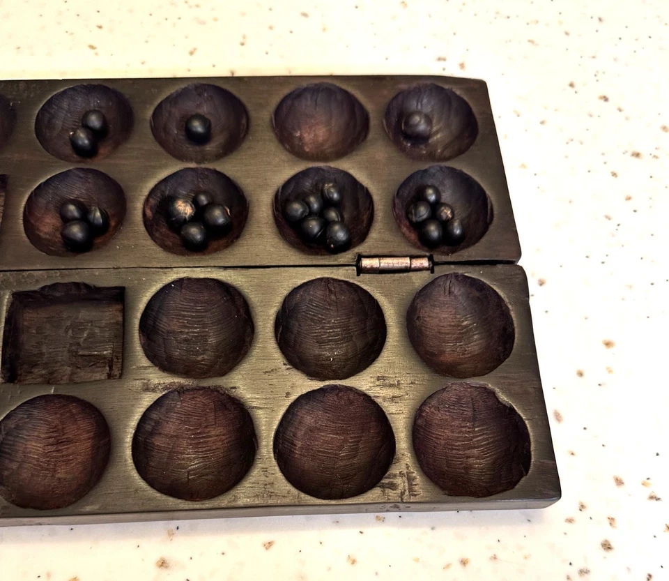 Juego de mesa Bao Mancala con 42 semillas talladas a mano en madera con diseño de elefantes rinocerontes Foto 4 de 4