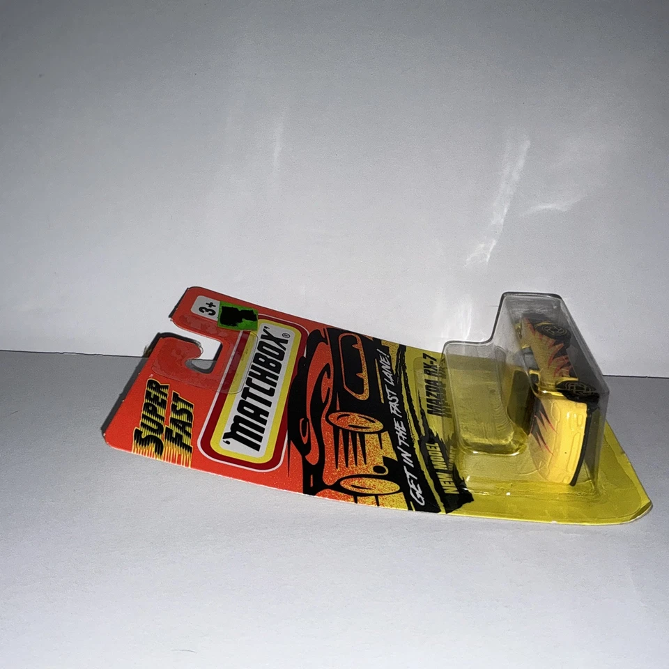 Matchbox 1993 MB 8 Mazda RX-7 color is yellow with orange & black graphics. - Image 4 of 4