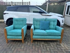 Two seater turquoise sofa and armchair