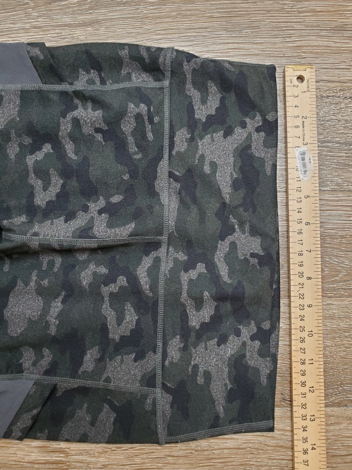 fabletics power hold athletic green camouflaged capri pants
