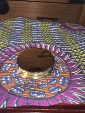 Brass Enclosed Magnifying Glass On A Hinge  With felt covered back.