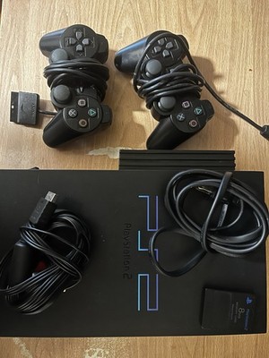 PlayStation 2 With Wires, 2 Controllers, And An 8 MB Memory Card