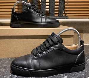 black leather louboutin trainers
