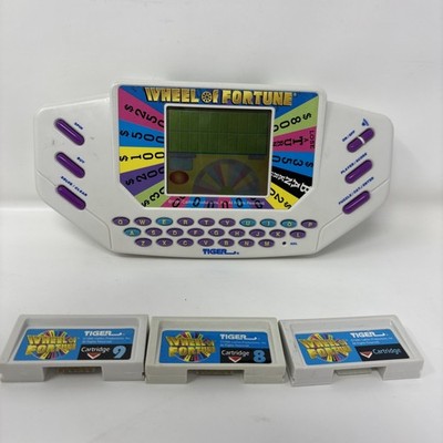 Vintage 1995 Tiger Electronics Wheel Of Fortune Hand Held Game With 3 Cartrig